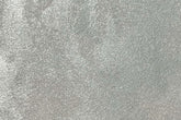 Satin Platinum metallic flexible wall panel – cool silver surface covered in fine hammered foil texture with subtle iridescent shimmer, flat lay close-up