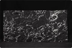 Veined Black Basalt flexible stone panel – full sheet front view showing dense silver-white fractured vein pattern across deep black three-dimensional surface on dark background